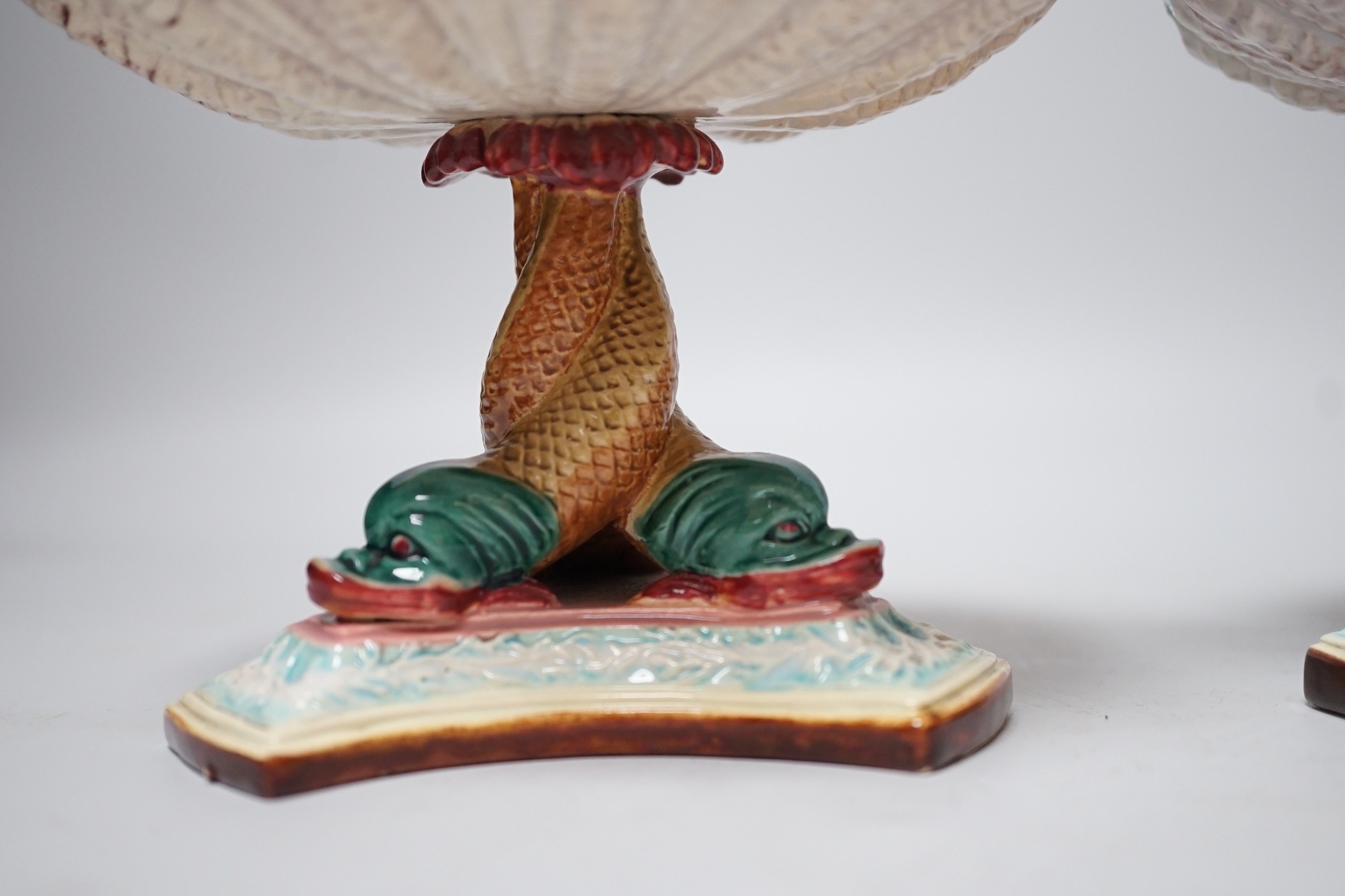 A pair of late 19th century Royal Worcester majolica dolphin comports, 10cm tall